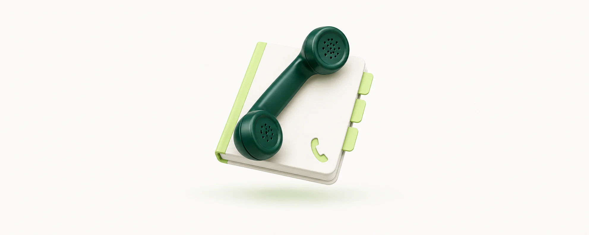 Ein dunkelgrüner Telefonhörer liegt auf einem hellen Adressbuch mit Registern.